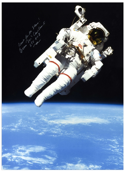 Bruce McCandless Signed 14'' x 19.25'' Photo of Him Performing the First Non-Tethered Spacewalk -- ''Reach for the Stars!''